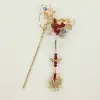 A nine-piece set of Chinese-style jewelry with red crystal charm, blue diamond flowing light, and golden branches adorned with blooming flowers details Picture